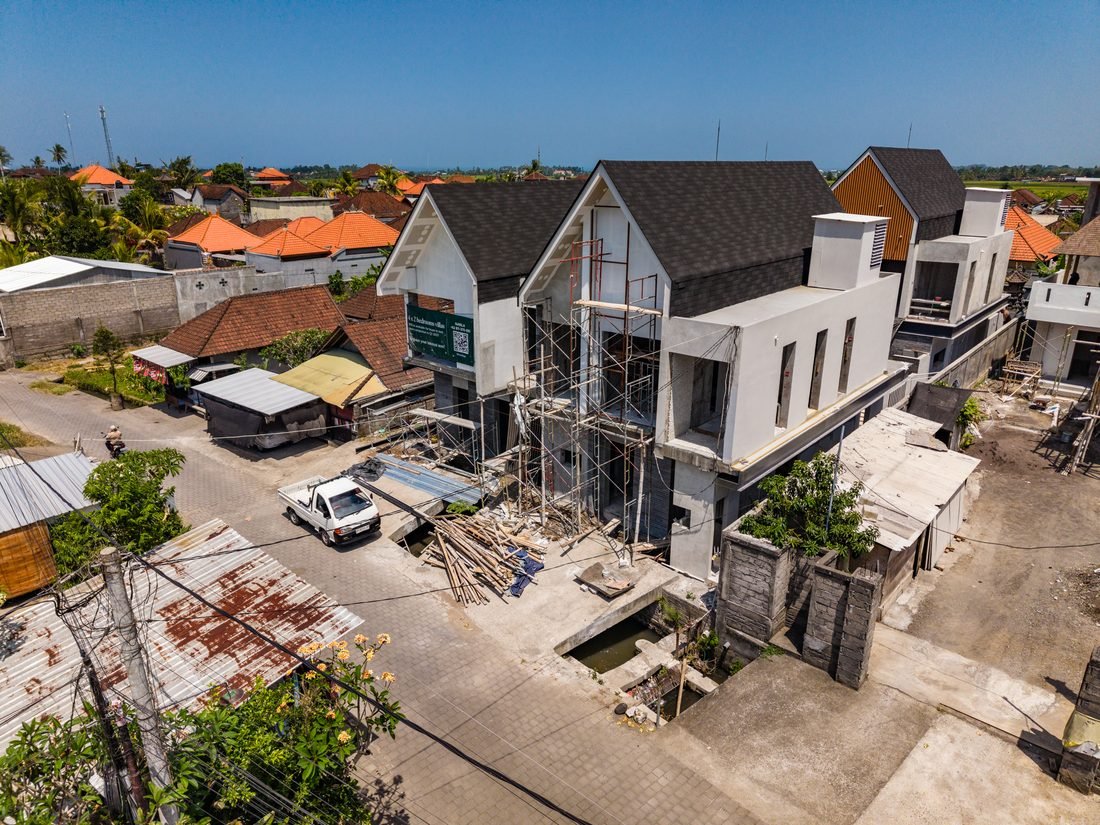 Scaffolding against the Four Palms villas during construction, 22 September 2026